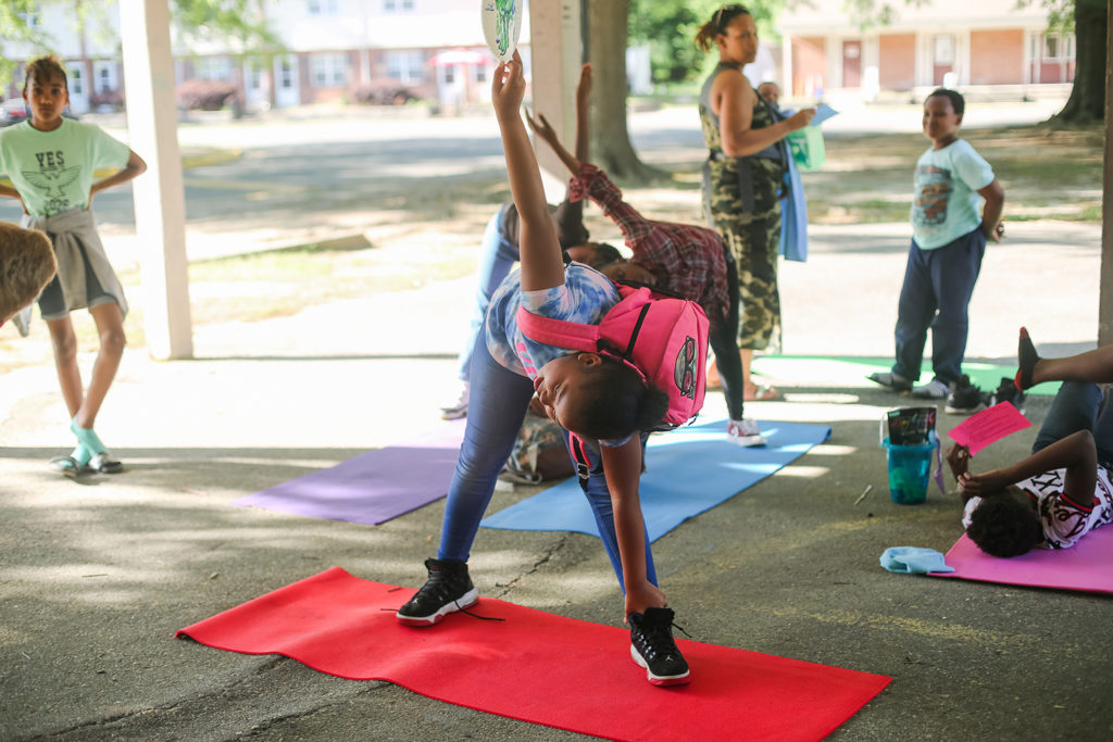 Yoga pose at Foundations of Health Celebration