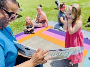 CHP Reads! employee reads to an excited audience