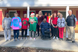 Residents at newly renovated Holly Court Apartments join the mayor and CHP staff for a resident celebration.