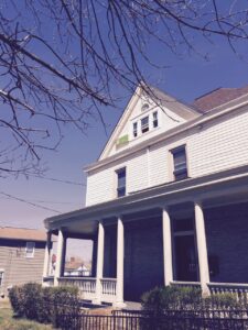 The white siding exterior of one of the homes that makes up Cornerstone Apartments